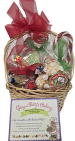 Gift basket with gingerbread-themed items and a label from Ginger Betty's Bakery on a white background.