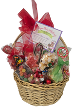Gourmet gift basket with candies and a red bow on a white background