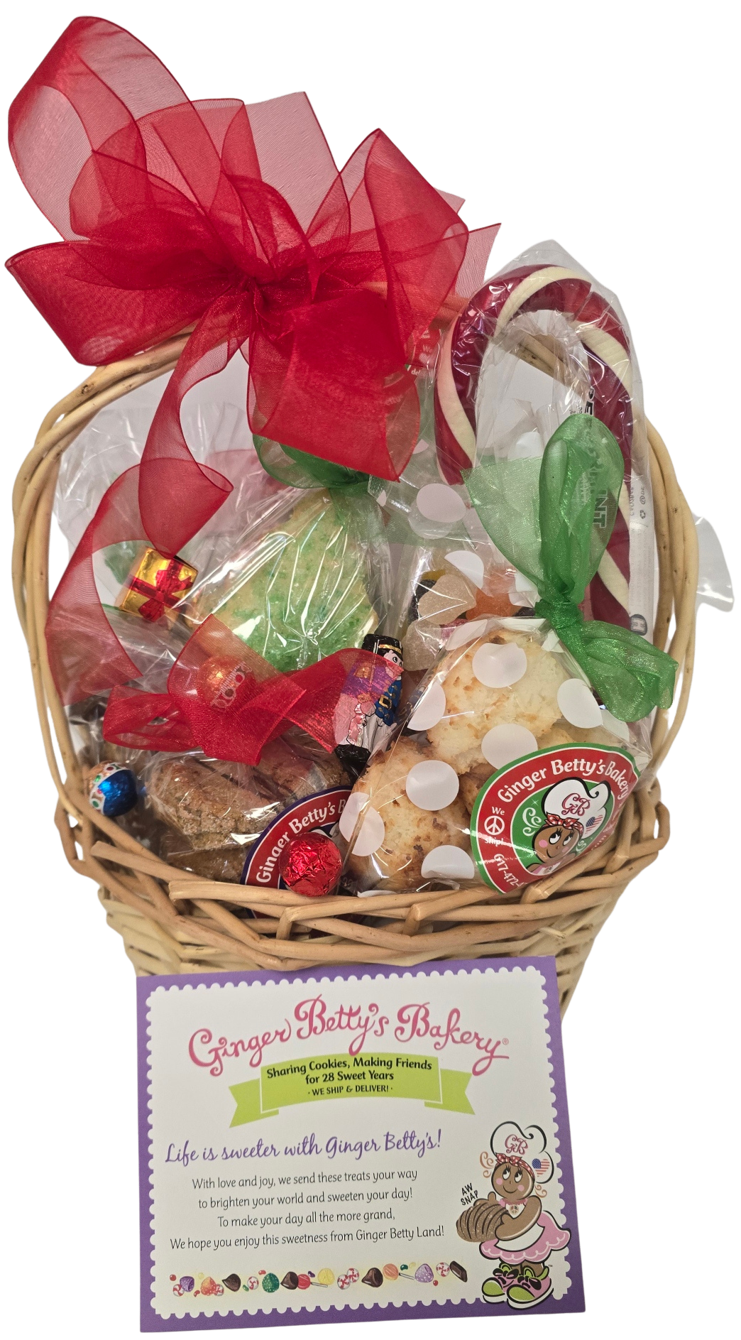 Ginger Butter Bakery gift basket with cookies, candy, and a red bow on a white background